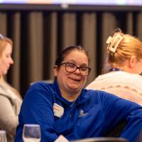 person laughing at table